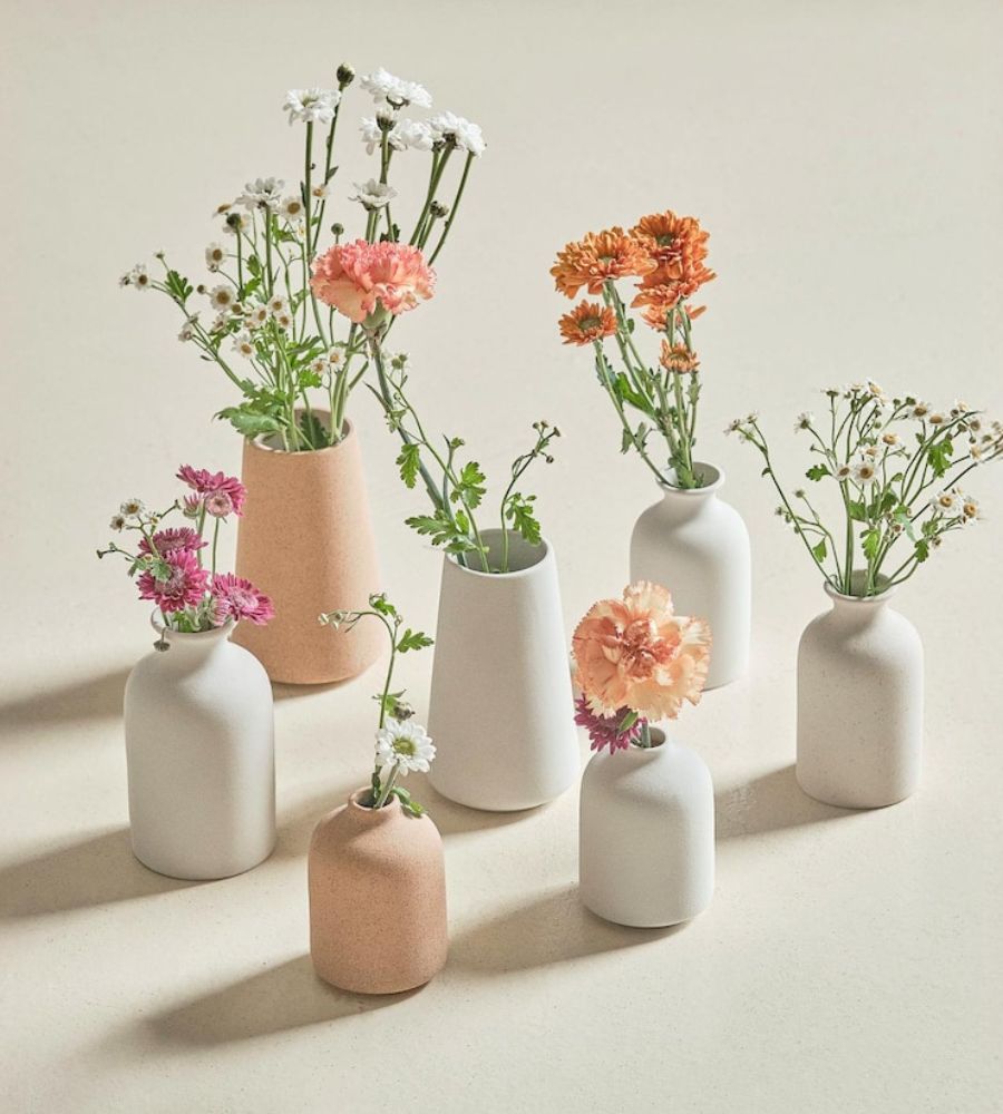 Troca de presentes no amigo secreto no Natal: vasos para flores e plantas de design sofisticado